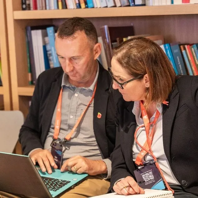 Two accredited H&A producers planning a games broadcast together over a laptop
