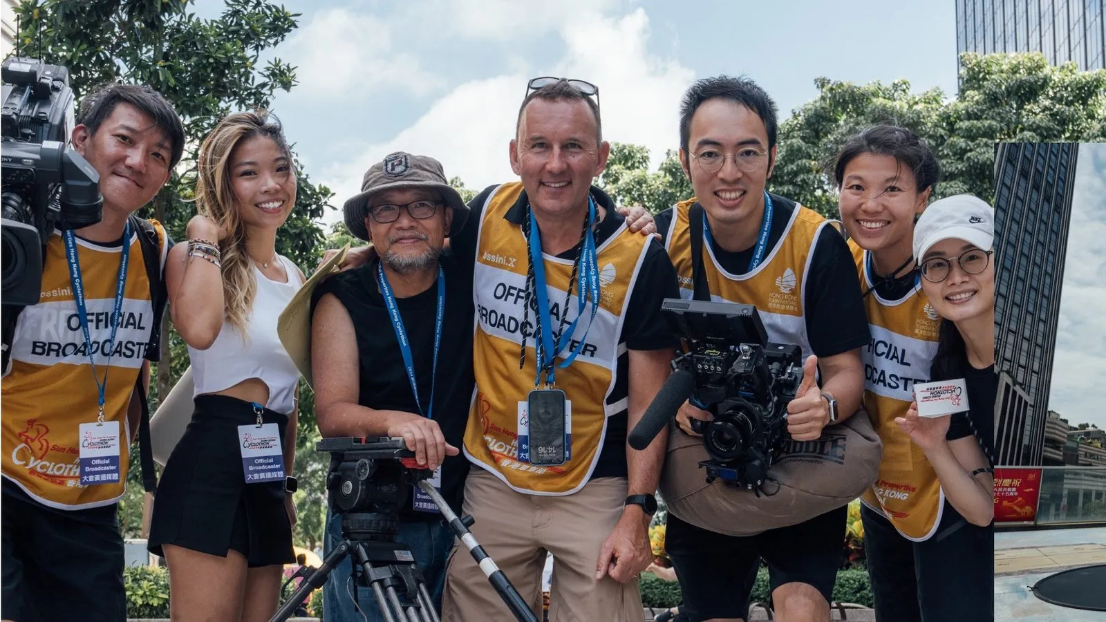 The H&A Media crew together on location, cameras and tripod in front of them, wearing official broadcaster bibs