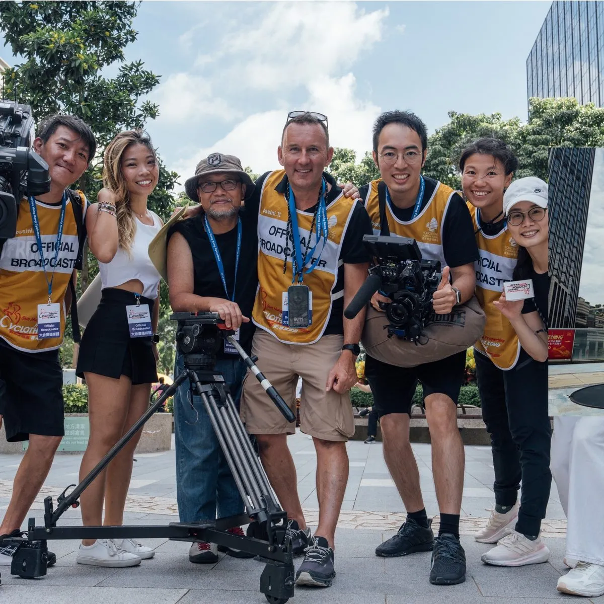 The H&A Media crew on location in official broadcaster bibs beside their camera dolly